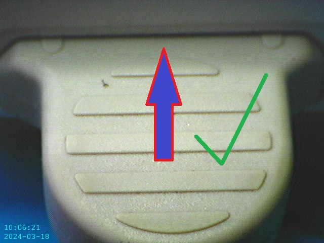A close-up of a buttonDescription automatically generated